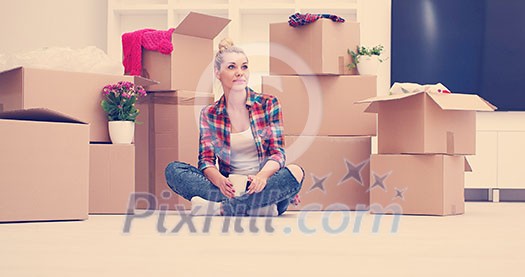 people, moving new place and repair concept happy beautiful young woman with many cardboard boxes sitting on floor with Cup at home people, moving new place and repair concept happy beautiful young woman with many cardboard boxes sitting on floor with Cup at home