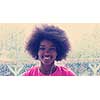 portrait of young afro american woman in gym on workout break while listening music on earphone and dancing rainy day and bad weather outdooor