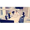 Group of a young business people discussing business plan at modern startup office building