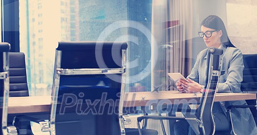 Businesswoman using tablet at the work in office Businesswoman using tablet at the work in office