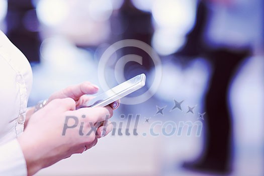 female manager using cell telephone in startup office interior female manager using cell telephone in startup office interior