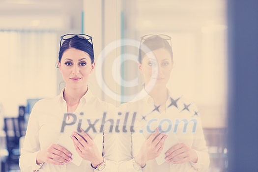 Pretty Businesswoman Using Tablet In front of startup Office Interior Pretty Businesswoman Using Tablet In front of startup Office Interior