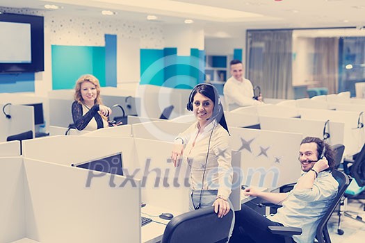 group of young business people with headset working and giving support to customers in a call center office group of young business people with headset working and giving support to customers in a call center office