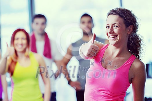 Group of people exercising at the gym and stretching Group of people exercising at the gym and stretching