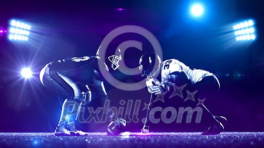 american football players are ready to start on field at night american football players are ready to start on field at night