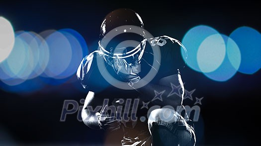 portrait of young confident American football player on field at night portrait of young confident American football player on field at night