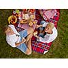 Couple in love enjoying picnic time drink and food in beautiful nature on the river bank top view