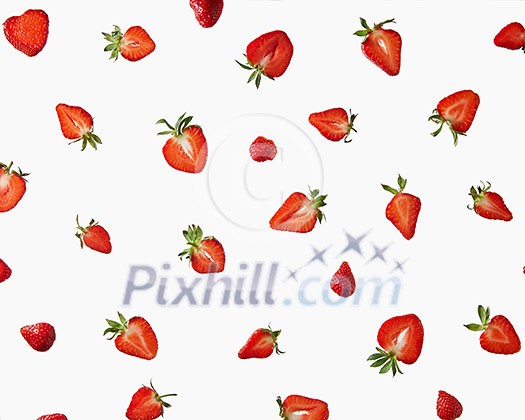 Halves of a fresh strawberry with green leaves on a gray background. Creative pattern of berries, flat lay Halves of a fresh strawberry with green leaves on a gray background. Creative pattern of berries, flat lay
