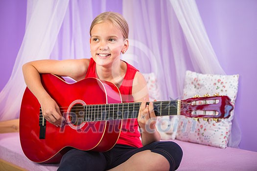 Teenage girl with her guitar in her lovely room Teenage girl with her guitar in her lovely room