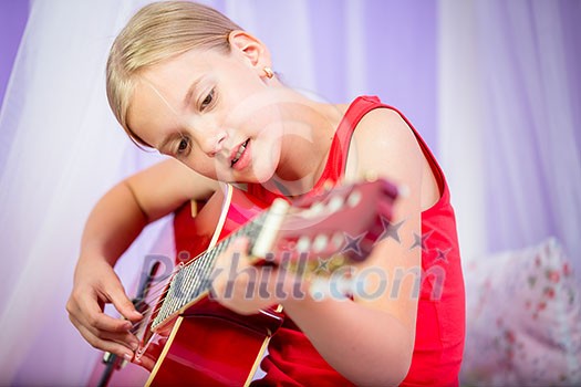 Teenage girl with her guitar in her lovely room Teenage girl with her guitar in her lovely room