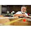 DIY concept - Senior man doing putting together kitchen cabinets