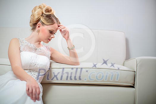 Gorgeous bride on her wedding day - not so thrilled about her big day(color toned image; shallow DOF) Gorgeous bride on her wedding day - not so thrilled about her big day(color toned image; shallow DOF)