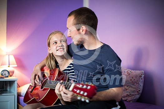 Teenage girl with her guitar in her lovely room Teenage girl with her guitar in her lovely room