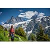 Pretty, female hiker/climber in a lovely alpine setting of Swiss Alps