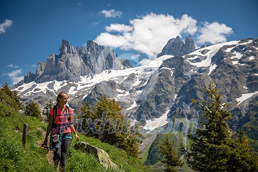 Pretty, female hiker/climber in a lovely alpine setting of Swiss Alps Pretty, female hiker/climber in a lovely alpine setting of Swiss Alps