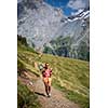 Pretty, female hiker/climber in a lovely alpine setting of Swiss Alps