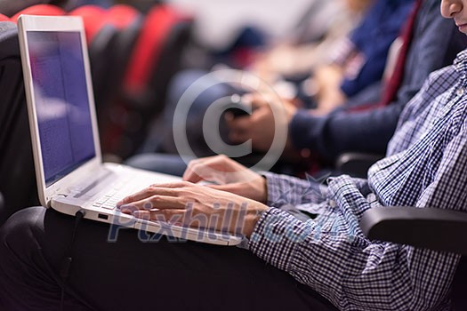 business people hands typing on laptop computer keyboard during the seminar at conference room business people hands typing on laptop computer keyboard during the seminar at conference room