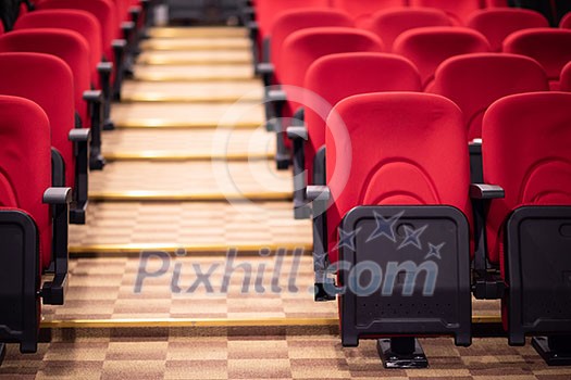 empty conference,theater or cinema hall with rows of red seats empty conference,theater or cinema hall with rows of red seats