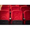 empty conference,theater or cinema hall with rows of red seats