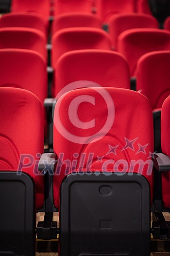 empty conference,theater or cinema hall with rows of red seats empty conference,theater or cinema hall with rows of red seats