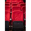 empty conference,theater or cinema hall with rows of red seats