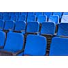 empty conference,theater or cinema hall with rows of blue seats