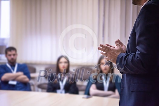 young businessman at business conference room with public giving presentations. Audience at the conference hall. Entrepreneurship club young businessman at business conference room with public giving presentations. Audience at the conference hall. Entrepreneurship club