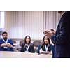 young businessman at business conference room with public giving presentations. Audience at the conference hall. Entrepreneurship club