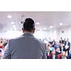 young businessman at business conference room with public giving presentations. Audience at the conference hall. Entrepreneurship club