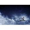 Businessman in suit sitting on cloud in isolation and looking at moon