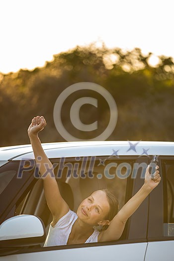Pretty, young woman driving her car - feeling happy after buying a new car (shallow DOF; color toned image) Pretty, young woman driving her car - feeling happy after buying a new car (shallow DOF; color toned image)