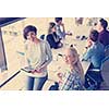 Business Women Using Digital Tablet in Busy Office