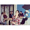 portrait of young business woman at modern startup office interior, team in meeting in background
