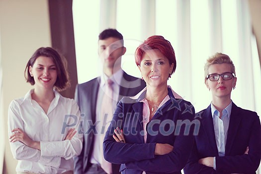 diverse business people group standing together as team in modern bright office interior with redhair senior woman in front as leader diverse business people group standing together as team in modern bright office interior with redhair senior woman in front as leader