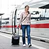 Pretty young woman at a train station