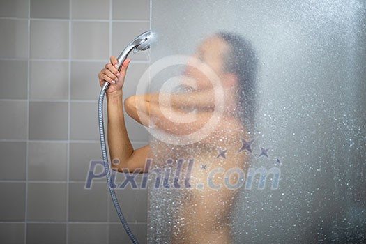 Pretty, young woman in shower Pretty, young woman in shower