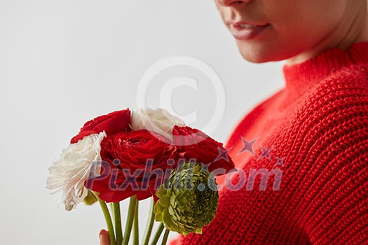 The girl without face with bouquet of flowers on a wtite background with place under text. The girl without face with bouquet of flowers on a wtite background with place under text.