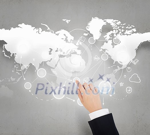 Businessman hand touching icon on world map concept Businessman hand touching icon on world map concept