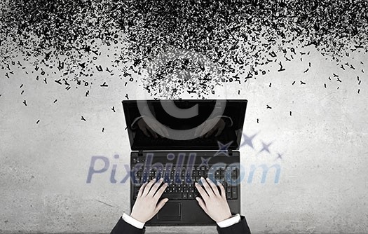 Top view of businesswoman hands using black laptop Top view of businesswoman hands using black laptop