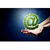 Close up of hands holding green email symbol