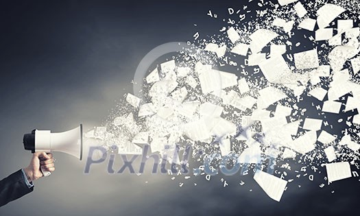 Businessman hand with loudspeaker and papers flying out Businessman hand with loudspeaker and papers flying out