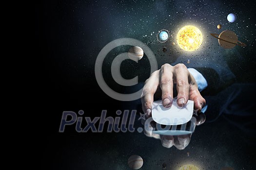 Hand of businessman in suit on dark background using wireless computer mouse Hand of businessman in suit on dark background using wireless computer mouse