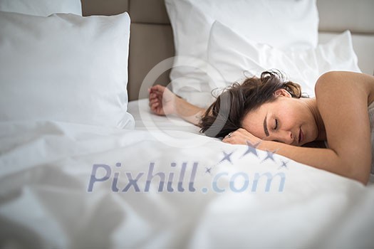Beautiful young woman sleeping on bed at bedroom Beautiful young woman sleeping on bed at bedroom