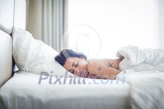 Beautiful young woman sleeping on bed at bedroom Beautiful young woman sleeping on bed at bedroom