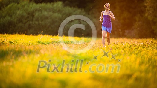 Young woman running outdoors on a lovely sunny summer evening (shallow DOF; color toned image) Young woman running outdoors on a lovely sunny summer evening (shallow DOF; color toned image)