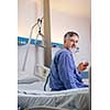 Senior male patient in a modern hospital (shallow DOF; color toned image)