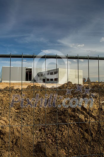 Construction site with a fence around it Construction site with a fence around it