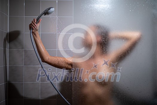Pretty, young woman in shower Pretty, young woman in shower