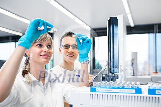 senior male researcher carrying out scientific research in a lab using a gas chromatograph (shallow DOF; color toned image) senior male researcher carrying out scientific research in a lab using a gas chromatograph (shallow DOF; color toned image)