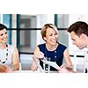 Businesswoman doing a presentaion in front of her collegues